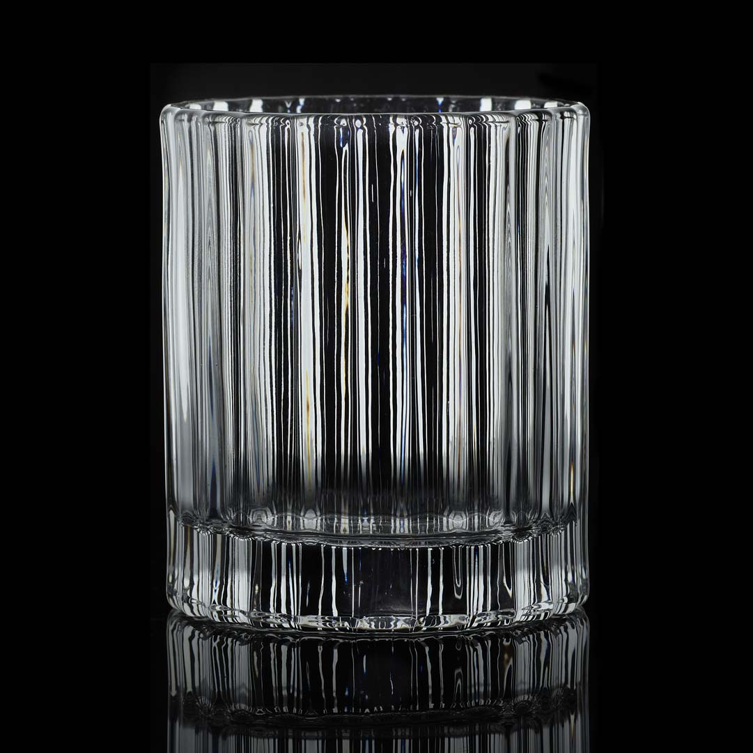 facted 11.5 ounce double old fashion glass on a black background and backlit.