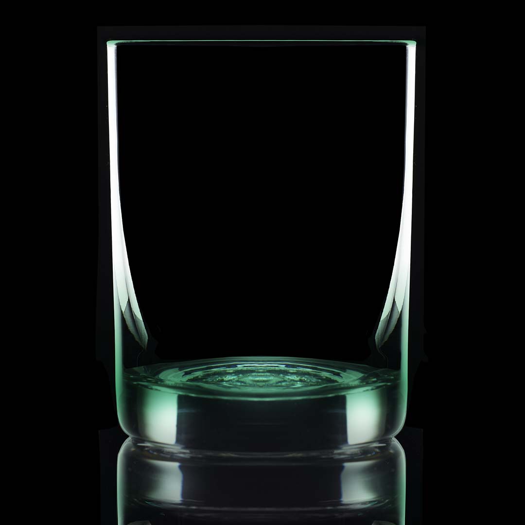 11.75 oz green bottom glass on a black background and backlit.