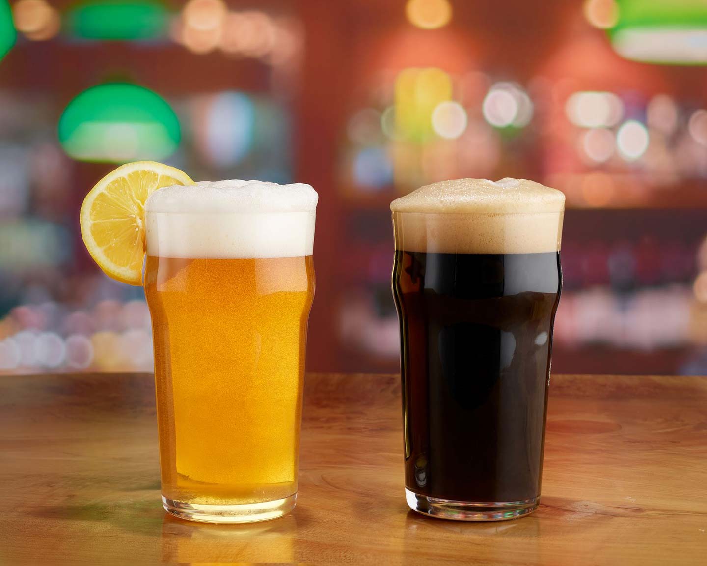 imperial pint nonic glasses holding pilsner and stout beers