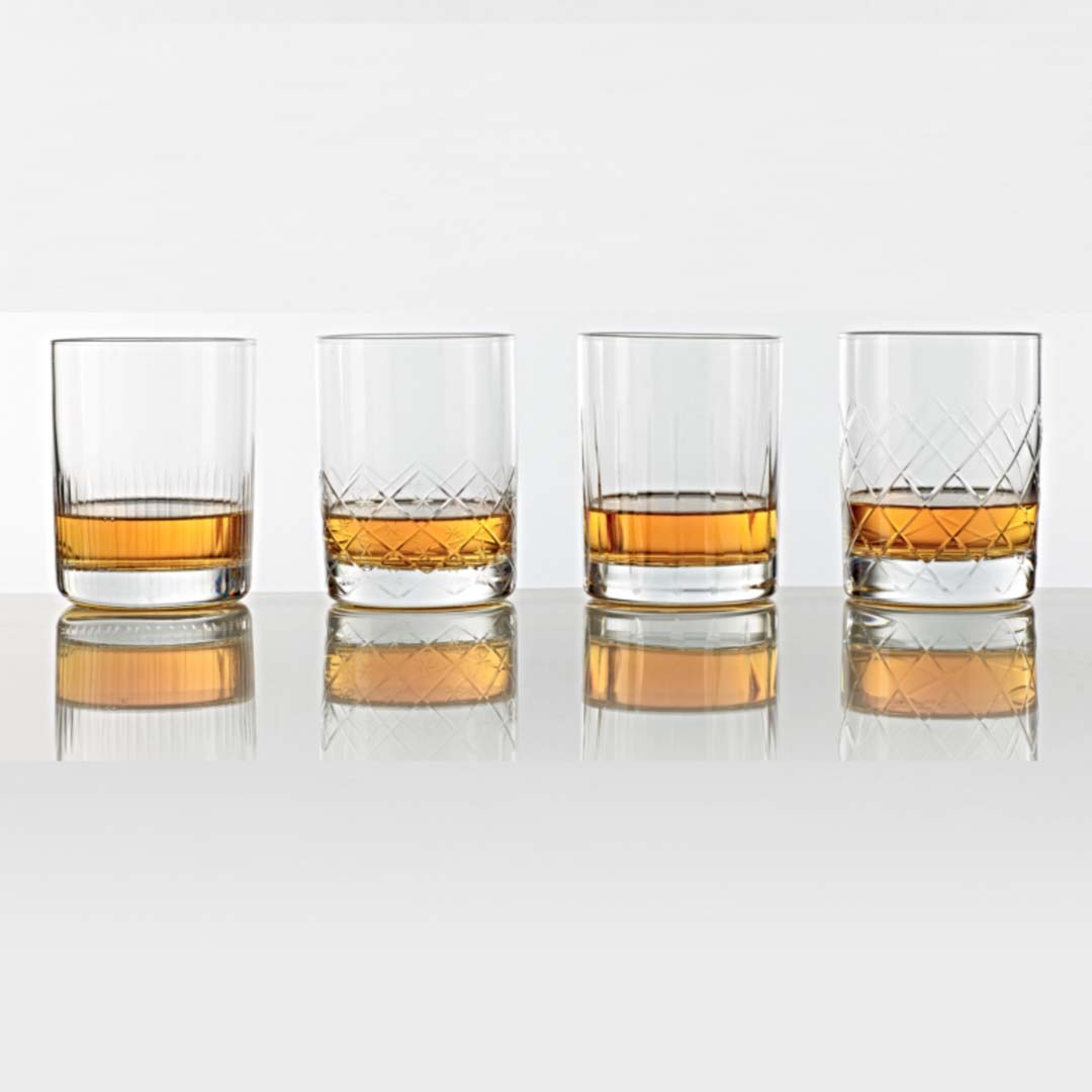 set of four unique double old fashioned glasses. All hand cut with a heavy base.