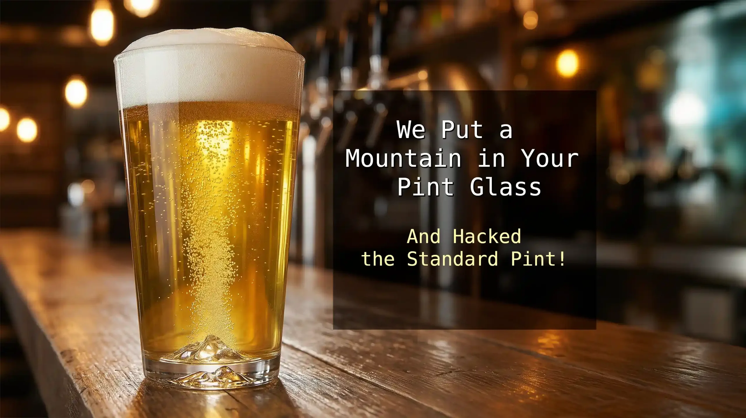 Burns Glass mountain pint glass with craft beer showing active nucleation bubble stream and thick head.