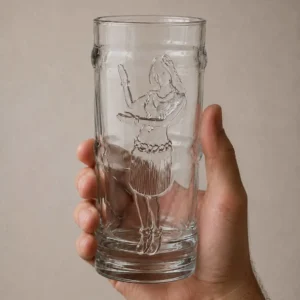 the hula girl tiki glass in a persons hand so you can see the size.